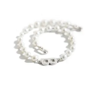 A silver pearl necklace in a classic