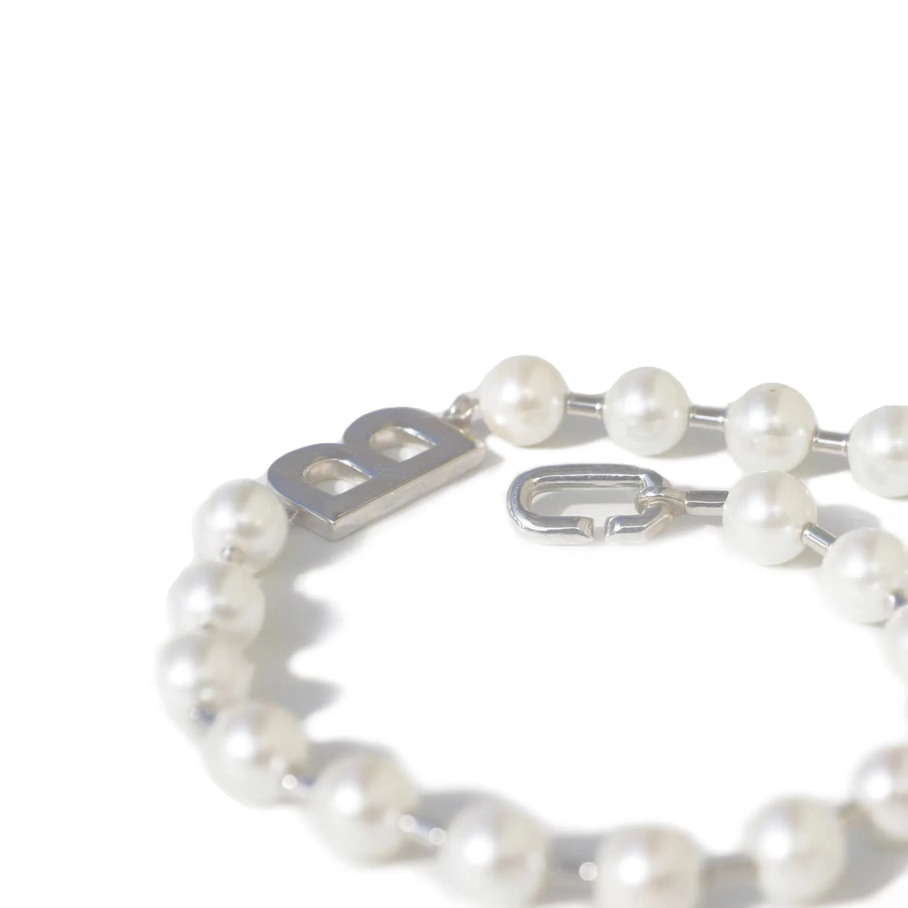 A silver pearl necklace in a classic