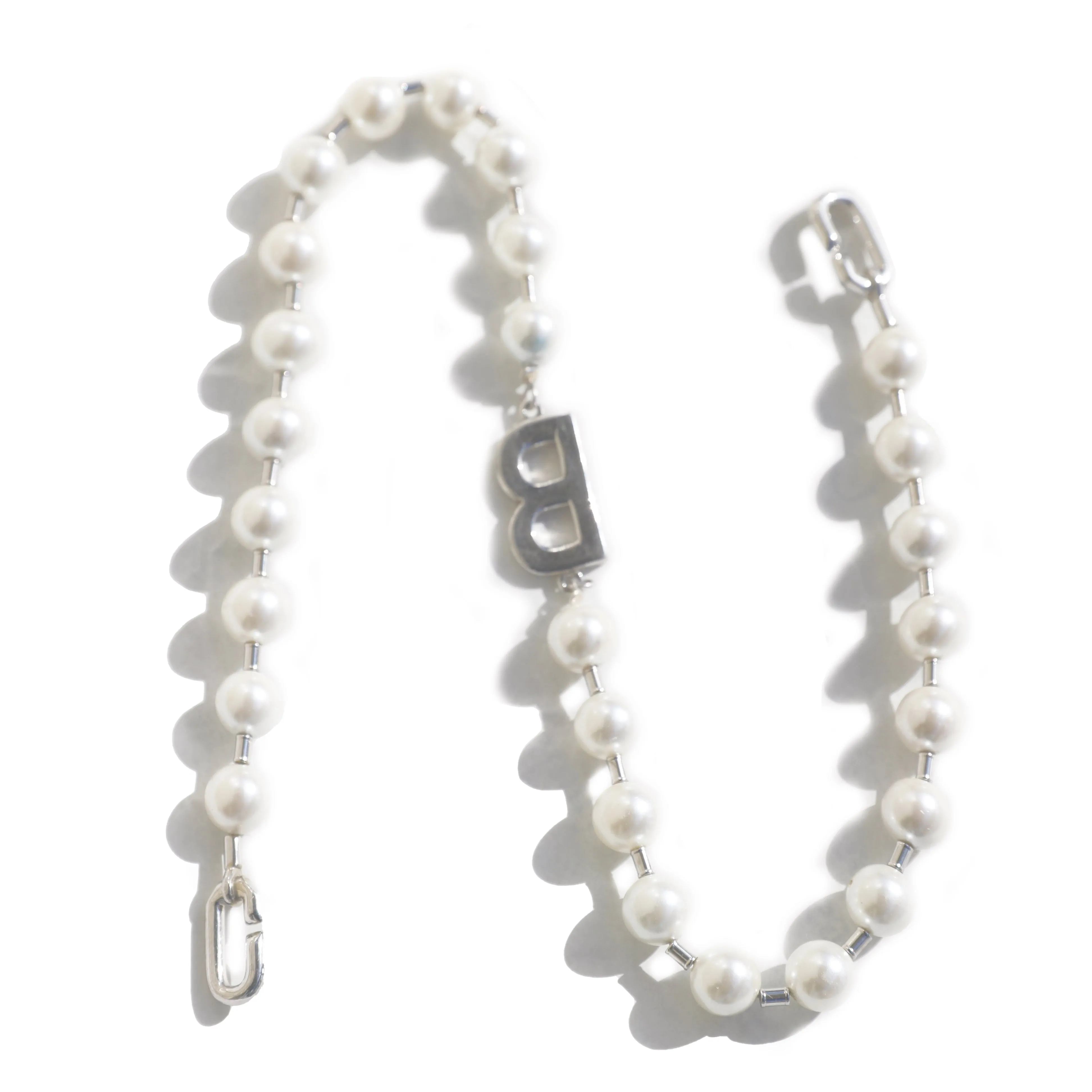 A silver pearl necklace in a classic