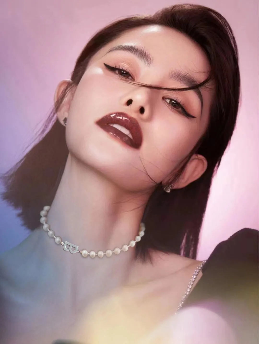 A silver pearl necklace in a classic